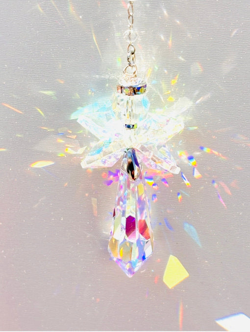 Handcrafted angel crystal suncatcher prism casting a vibrant full spectrum of color therapy rainbows