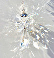Unique handmade Fairy Angel suncatcher made from Swarovski crystals being illuminated by the sun and casting incredible prisms. 