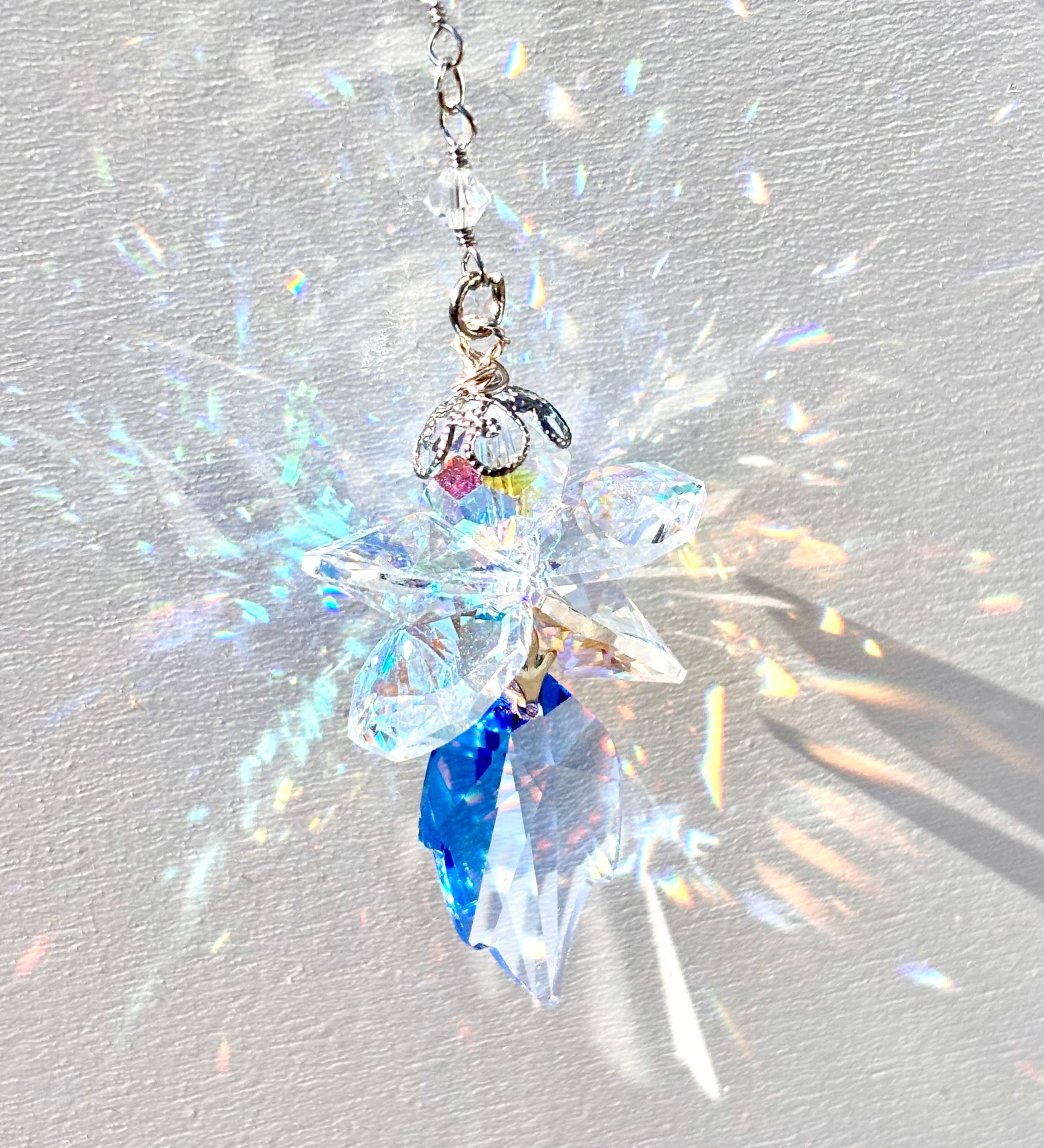 Unique Fairy suncatcher made of rare Swarovski crystals releasing amazing rainbows as the sun hits it.