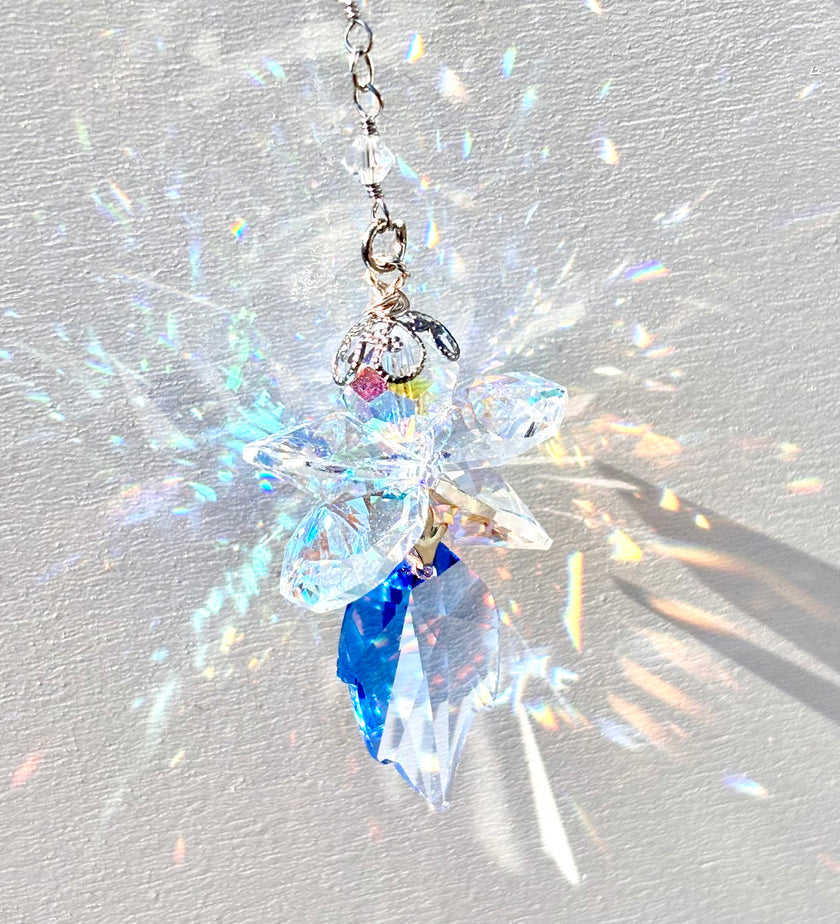 Unique Fairy suncatcher made of rare Swarovski crystals releasing amazing rainbows as the sun hits it.