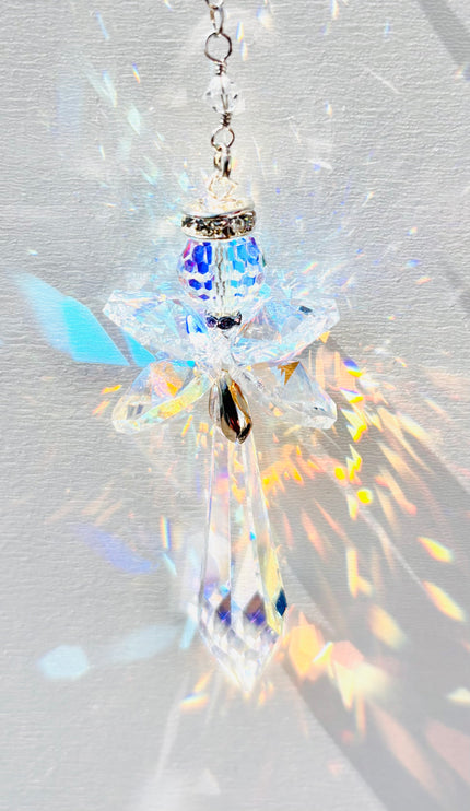Rare handmade Swarovski crystal angel creating beautiful rainbows while the sun hits it. 