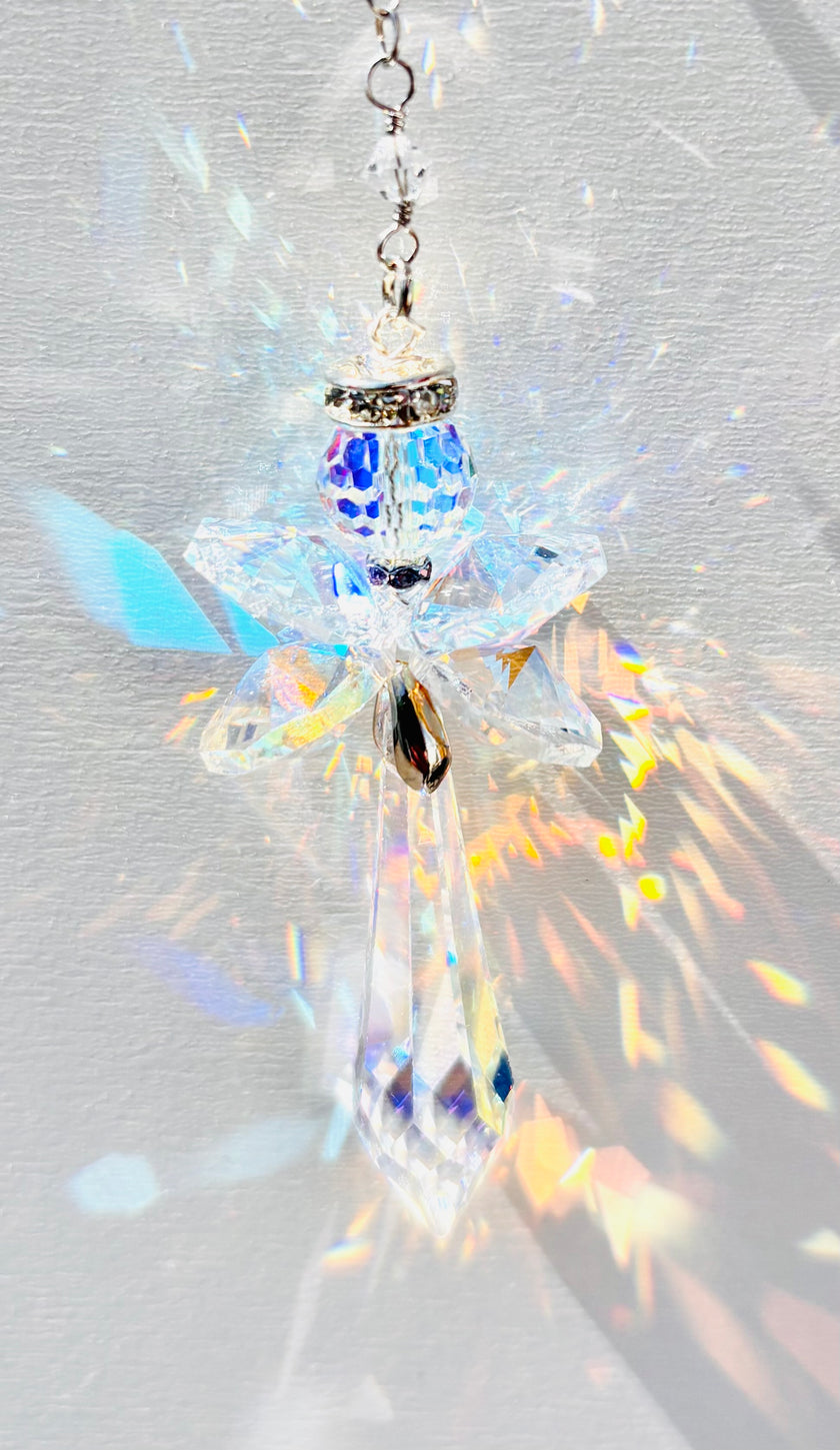 Rare handmade Swarovski crystal angel creating beautiful rainbows while the sun hits it. 