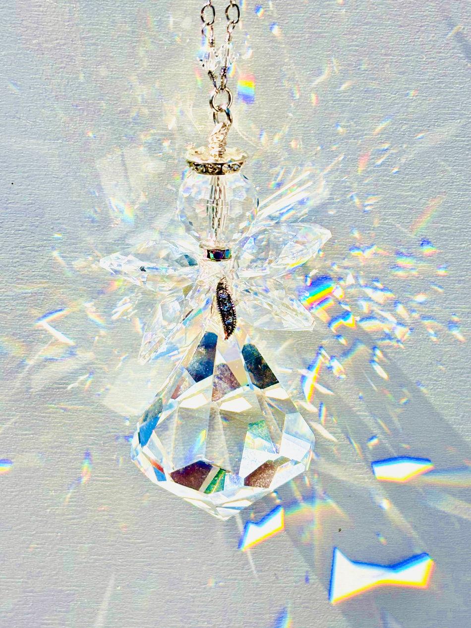 Unique handmade Angel Suncatcher made of rare Swarovski crystals that create magnificent sparkle and amazing prisms when sun illuminates it. 