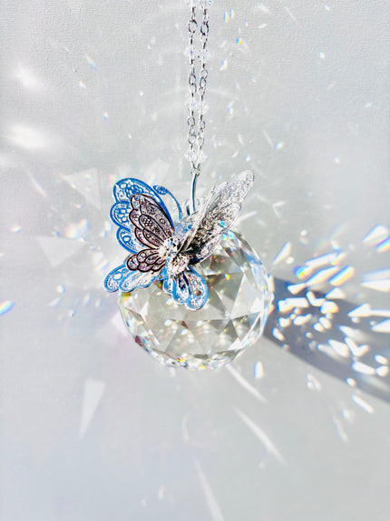 Rare 50mm Swarovski Crystal Ball adorned with silver rhinestone butterfly creating amazing sparkle and beams of light.
