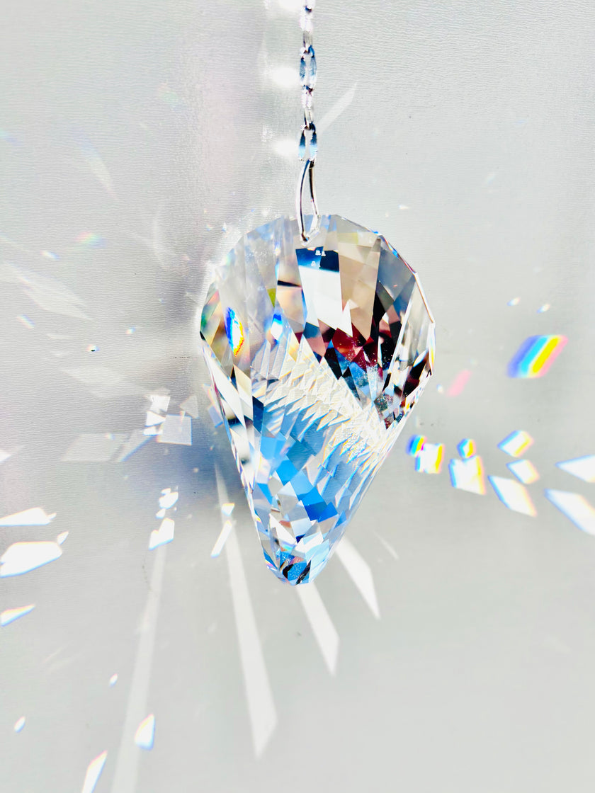 Rare Swarovski Oliod suncatcher illuminating large prisms of light as the sun its it beauty.