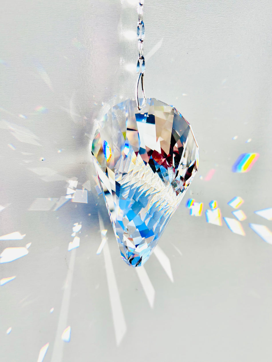 Rare Swarovski Oliod suncatcher illuminating large prisms of light as the sun its it beauty.