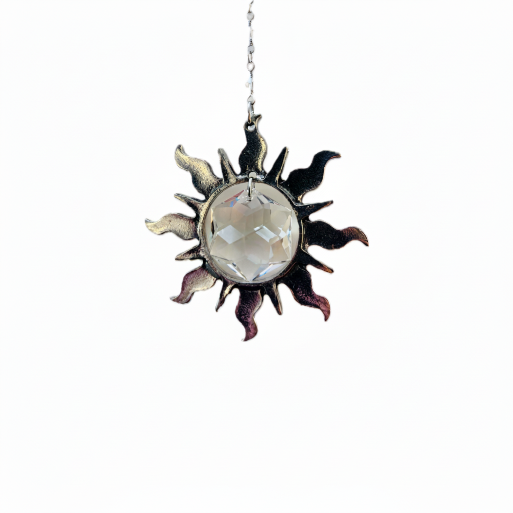 Handcrafted suncatcher featuring a pewter sun with a Swarovski Hex Crystal inside hung on a Swarovski Crystal strand with hook.  Named Sunspired with magical story card and packaged as gift.