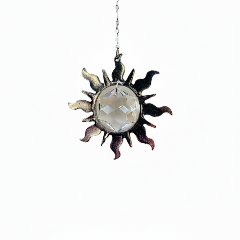 Handcrafted suncatcher featuring a pewter sun with a Swarovski Hex Crystal inside hung on a Swarovski Crystal strand with hook.  Named Sunspired with magical story card and packaged as gift.