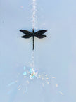 Decorative dragonfly ornament with crystals creating magical rainbows. 